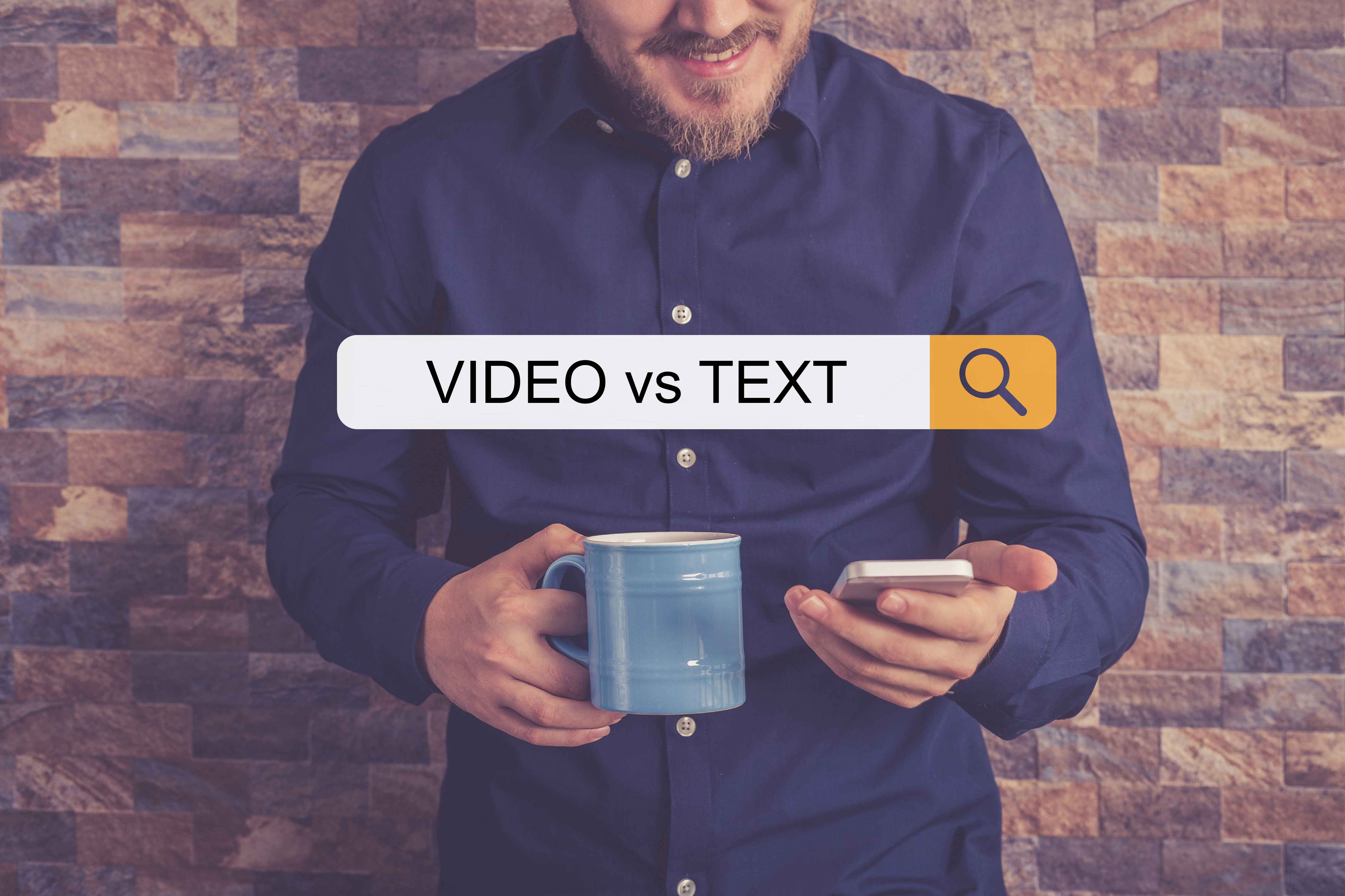Man with a phone in the article Text Versus Video
