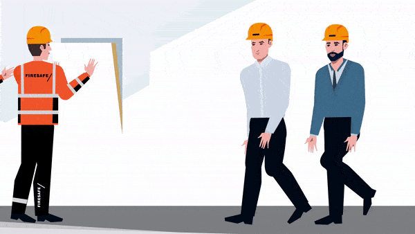 Workers in helmets inspecting a construction site