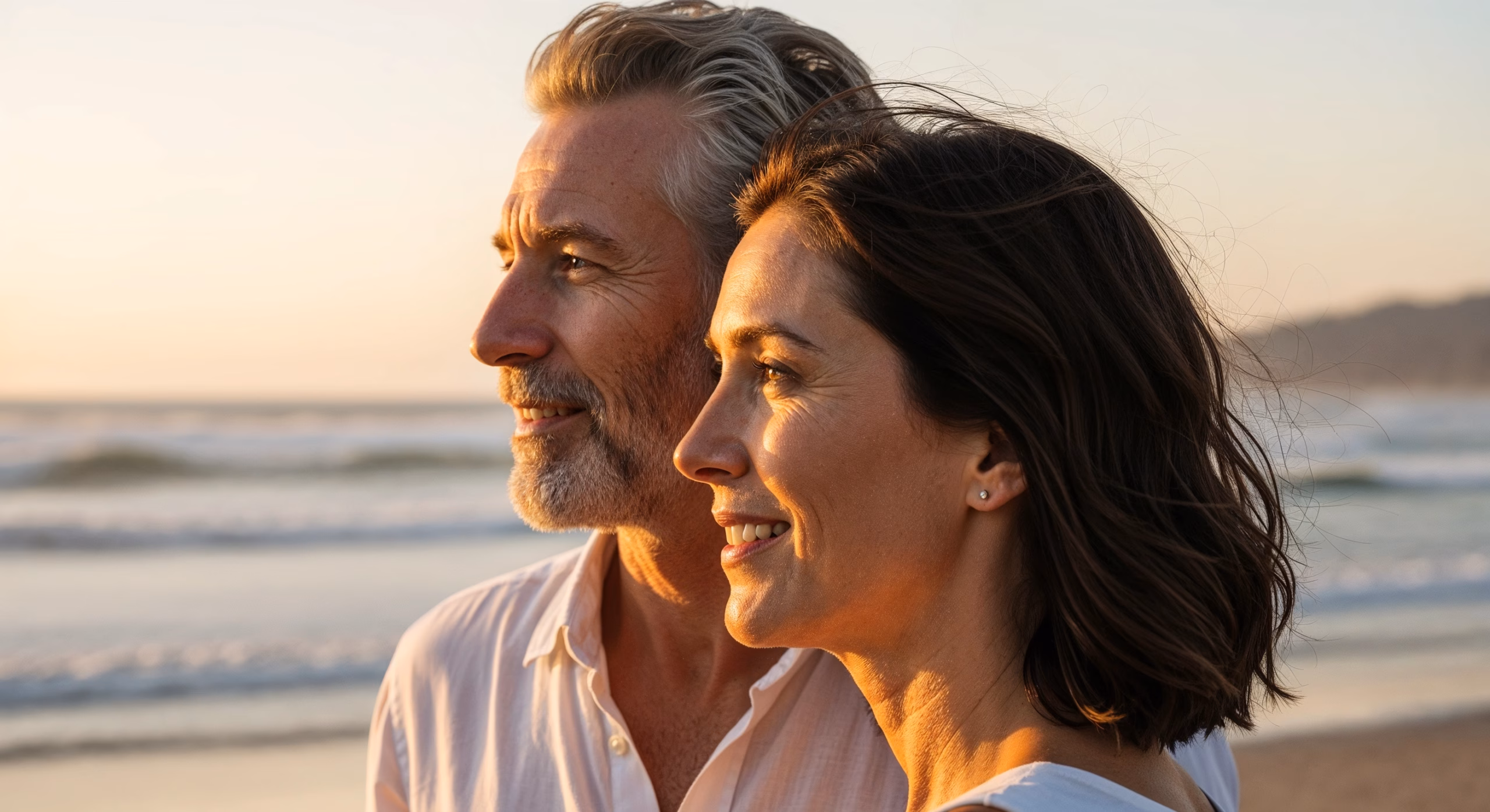 Cinematic profile two-shot at sunset, enhanced by natural wind animation in hair, soft environmental lighting, and calm epilogue-style composition.